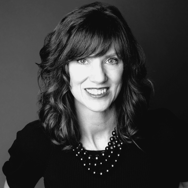 Portrait of Tina, a professional stylist at Maxine Salon, showcasing their expertise and style.